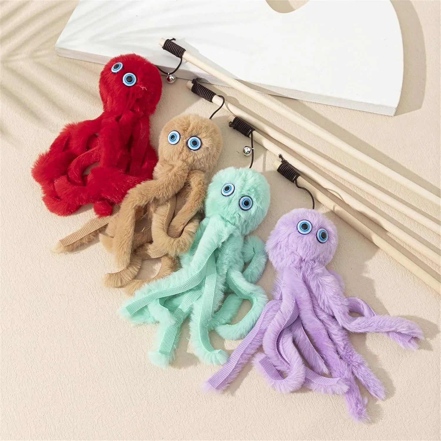 Octopus-themed cat toy with long stick handle and moving eyes for indoor play with kittens