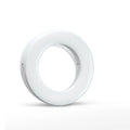 Compact black LED selfie ring light for mobile phone with USB cable for recharging.