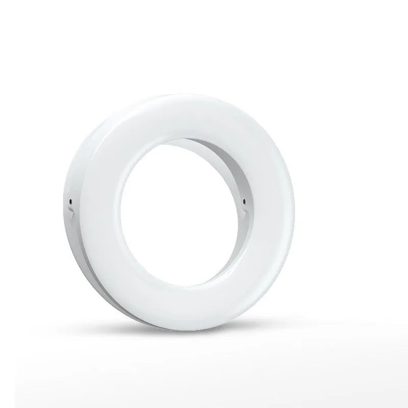 Compact black LED selfie ring light for mobile phone with USB cable for recharging.