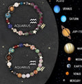 Set of twelve natural stone beaded bracelets, each representing a different zodiac sign.