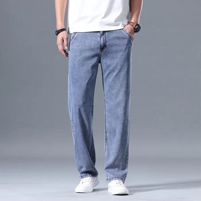 Men's loose straight-leg lyocell jeans in blue and grey colour options with zipper fly