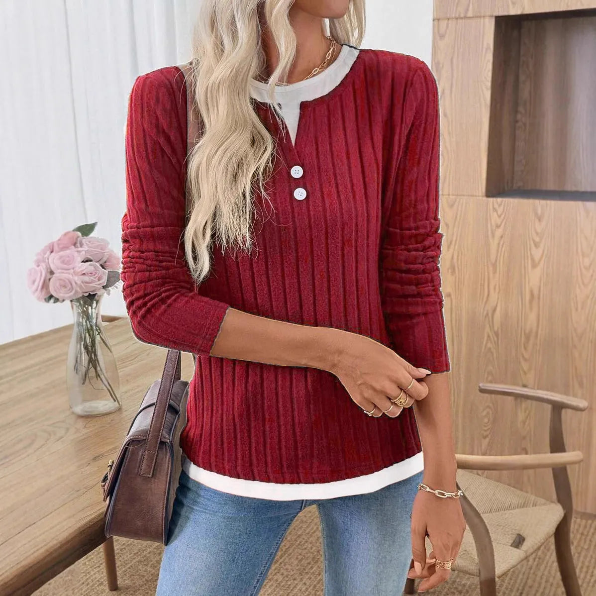 Women's grey fake two-piece striped pullover sweater with round neck and button detail.