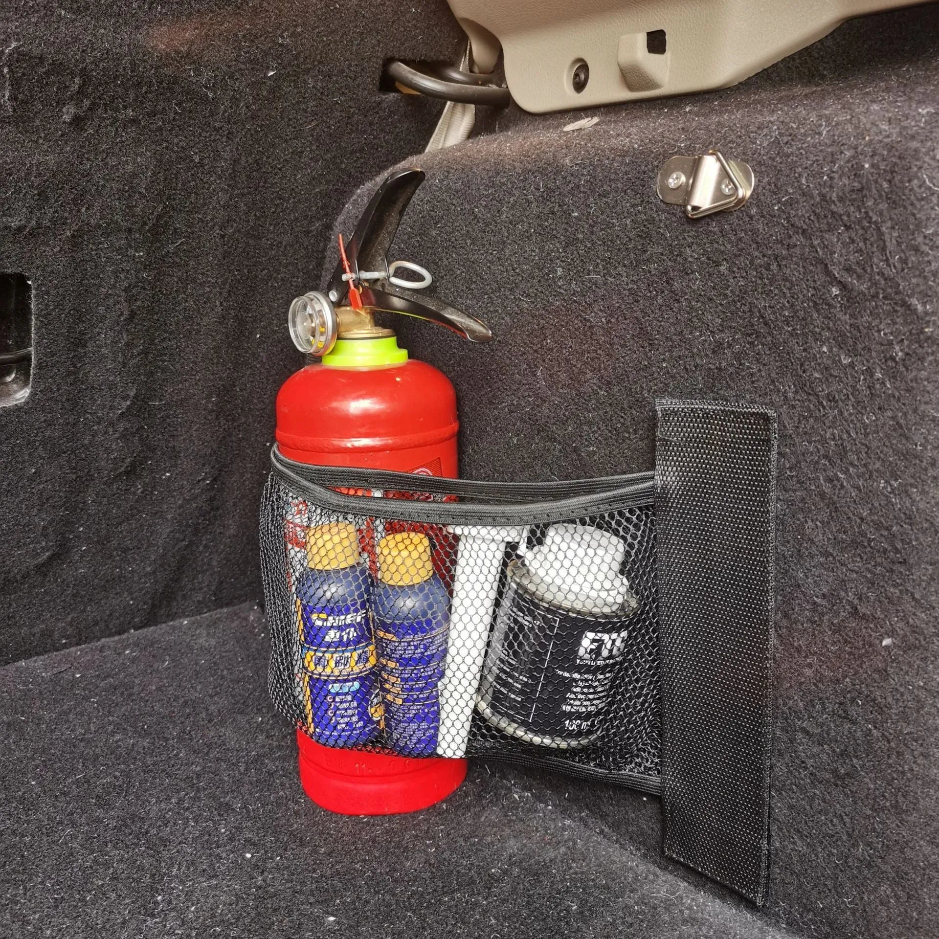 Elastic polyester car boot storage net shown holding shopping bags, available in 20x45cm or 20x35cm sizes.