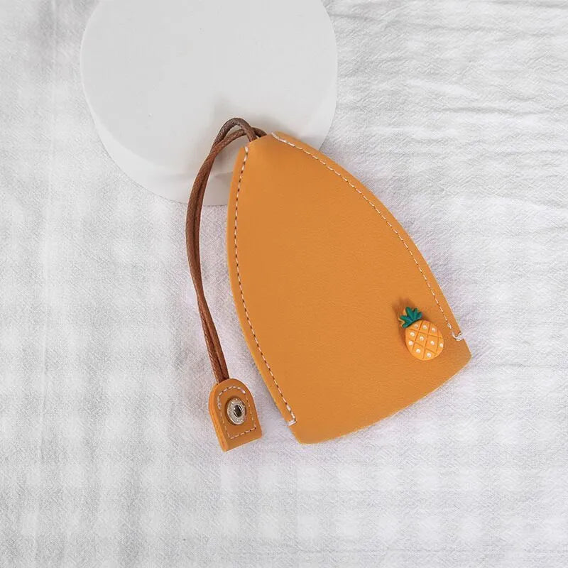 Cartoon design pull-out car key case made from soft PU leather, showing approximate size.