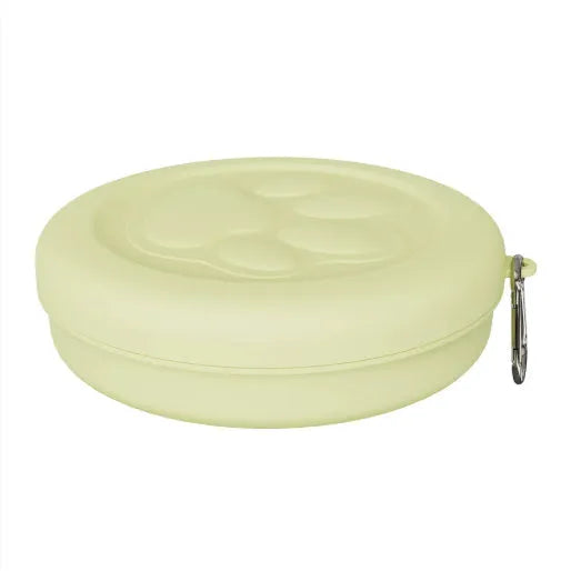 Portable dog feeding bowl with snack compartment lid in light green colour