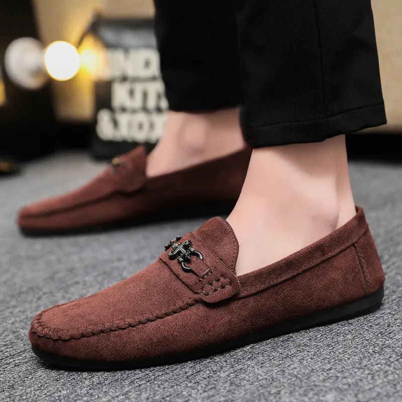 Men's waterproof black slip-on loafers with round toe and low stiletto heel on a rubber sole.