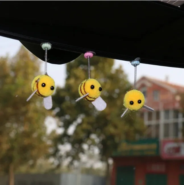 Swing spring bee car decoration made from a fur ball, measuring 3cm by 3cm.