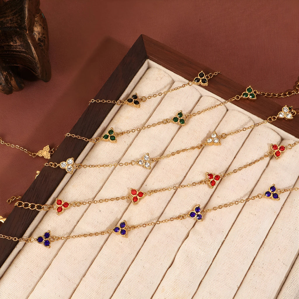 Geometric triangle women's bracelet in stainless steel with a choice of coloured centre stones on a gold or steel band.