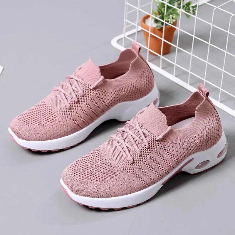 Women's black mesh casual sneakers with lace-up front and a light grey PVC sole.