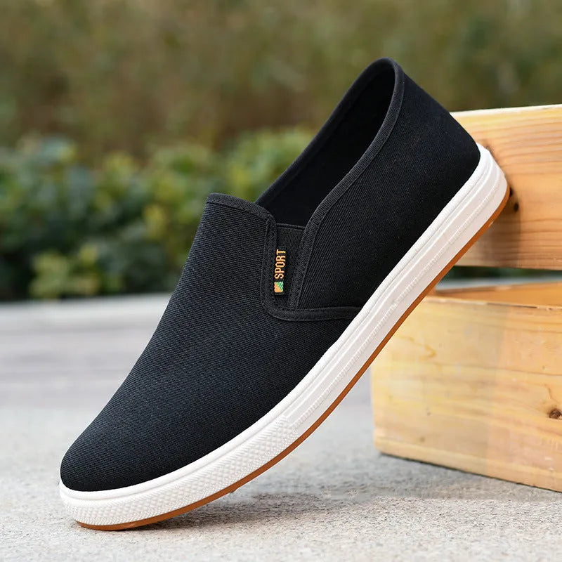 Men's low-top canvas slip-on shoes in BK Black colour with round toe design