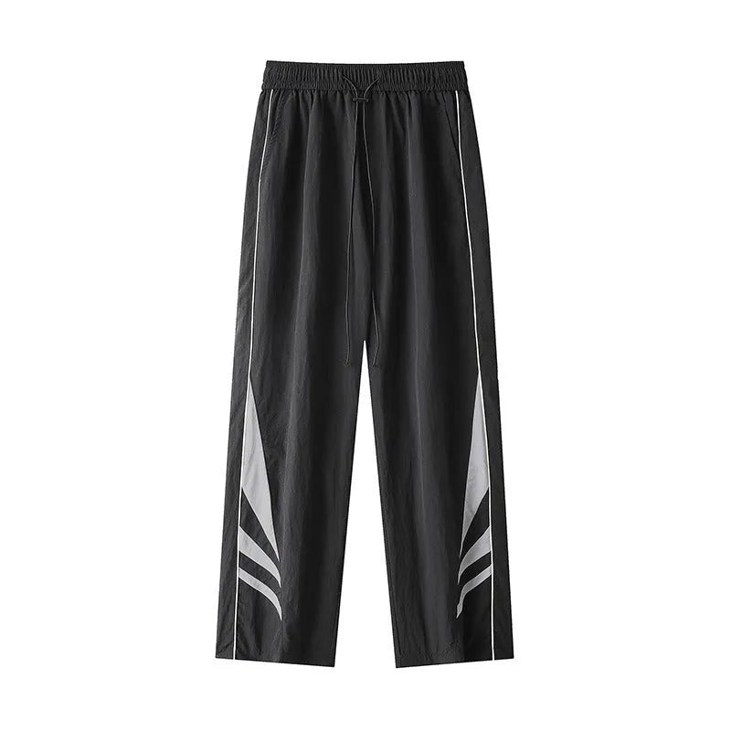 Black straight-leg loose-fit trousers on a plus-size male model for summer casual wear.