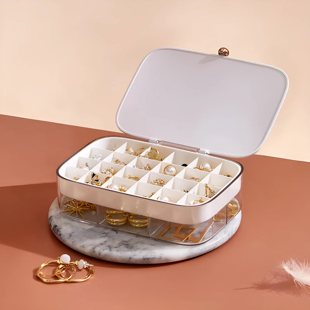 Green minimalist multi-layer jewellery storage box with compartments for earrings and necklaces.