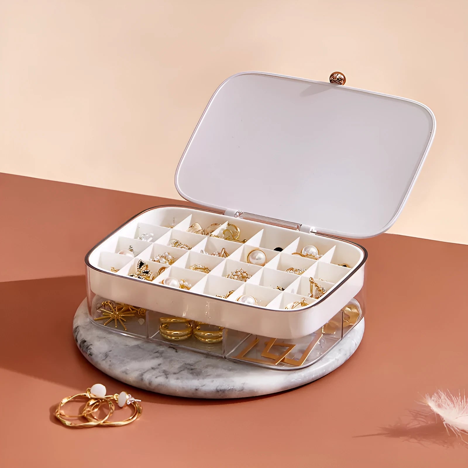 Green minimalist multi-layer jewellery storage box with compartments for earrings and necklaces.