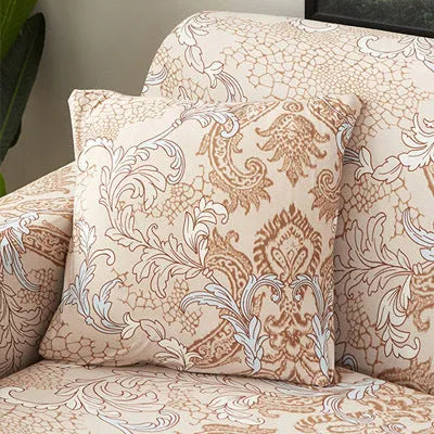 Geometric abstract printed stretch sofa slipcover covering a three-seater sofa with matching cushion covers.