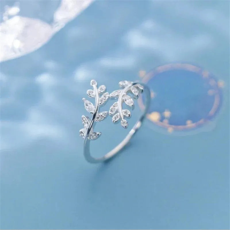 Geometric copper branch leaf ring for women in gold or silver electroplated finish.