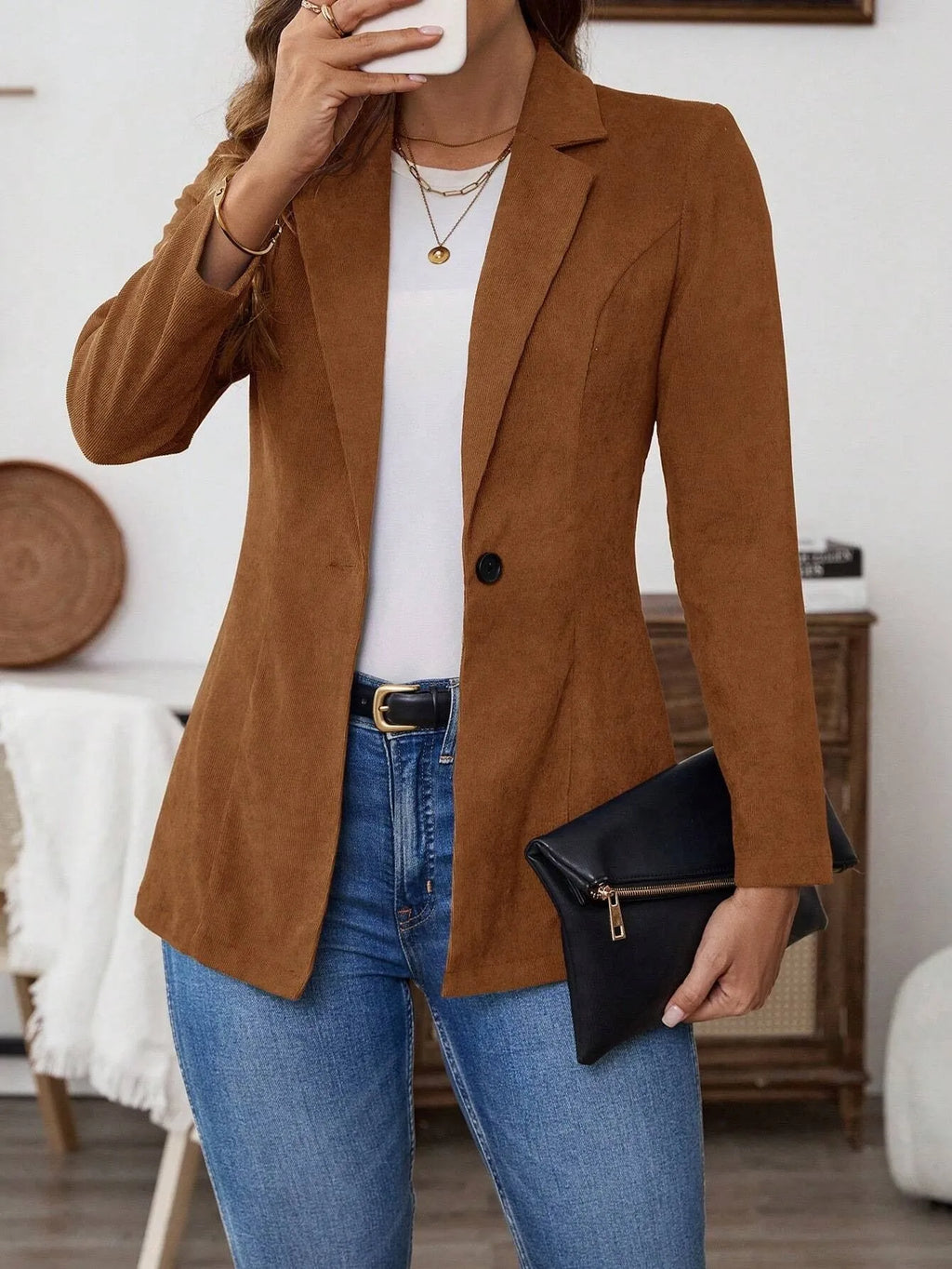 Brown men's single-breasted suit coat with lapel collar and long sleeves.