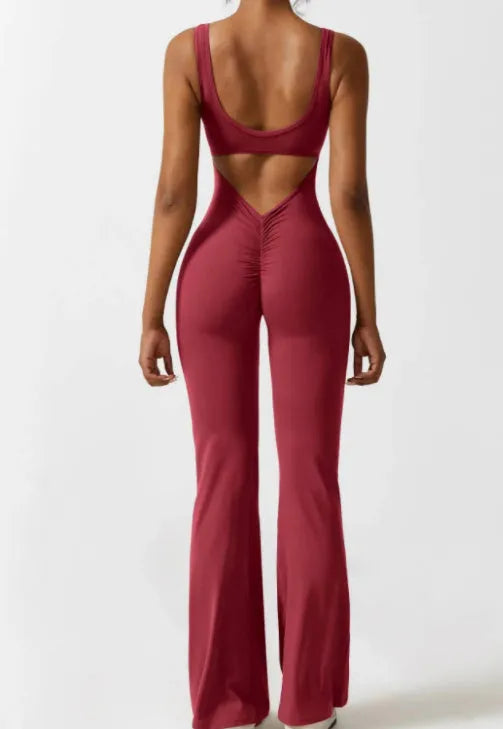 Women's black milk silk yoga bodysuit with seamless hollow design and mid-waist fit.