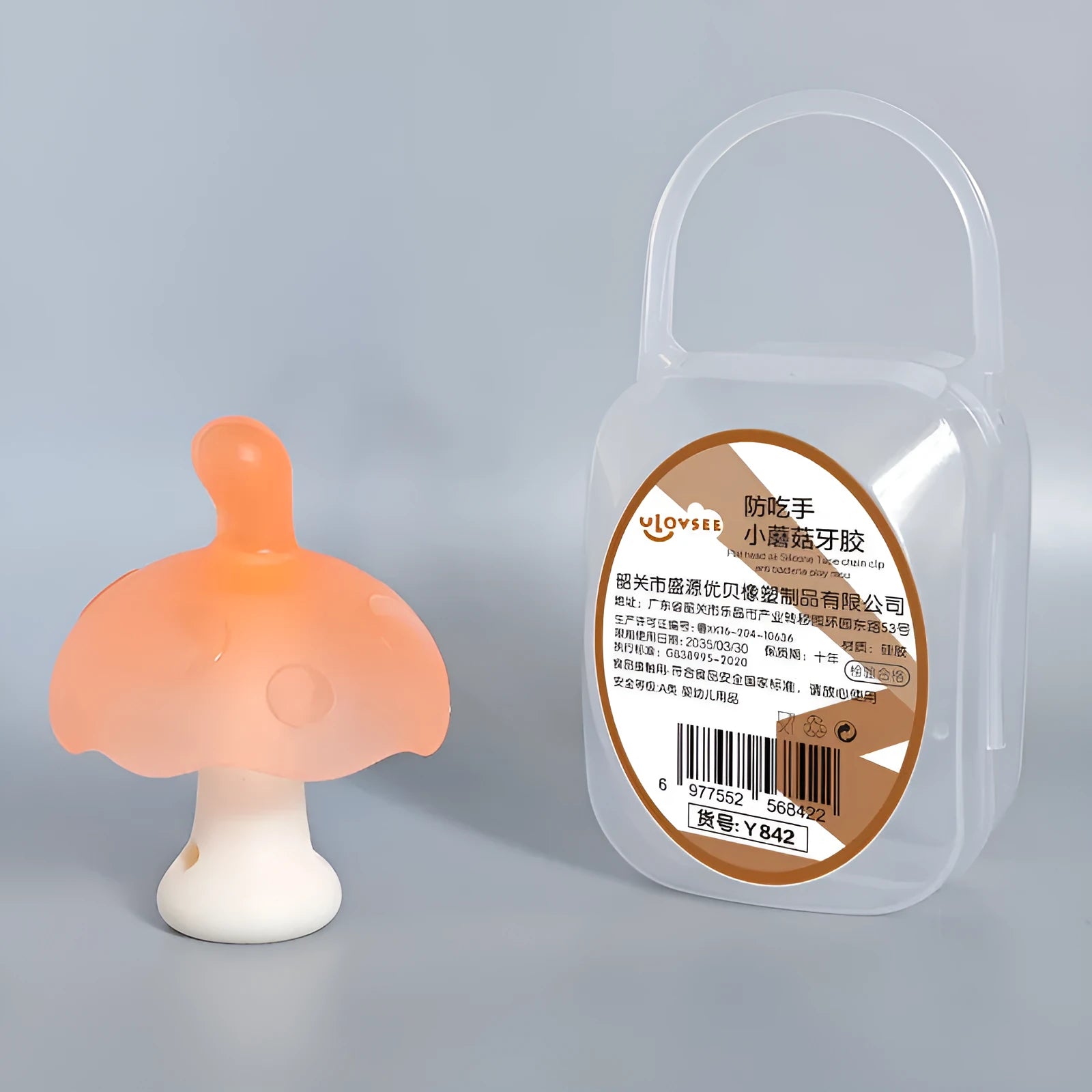 Small mushroom-shaped silicone chew gum with transparent chain attachment in pink colour