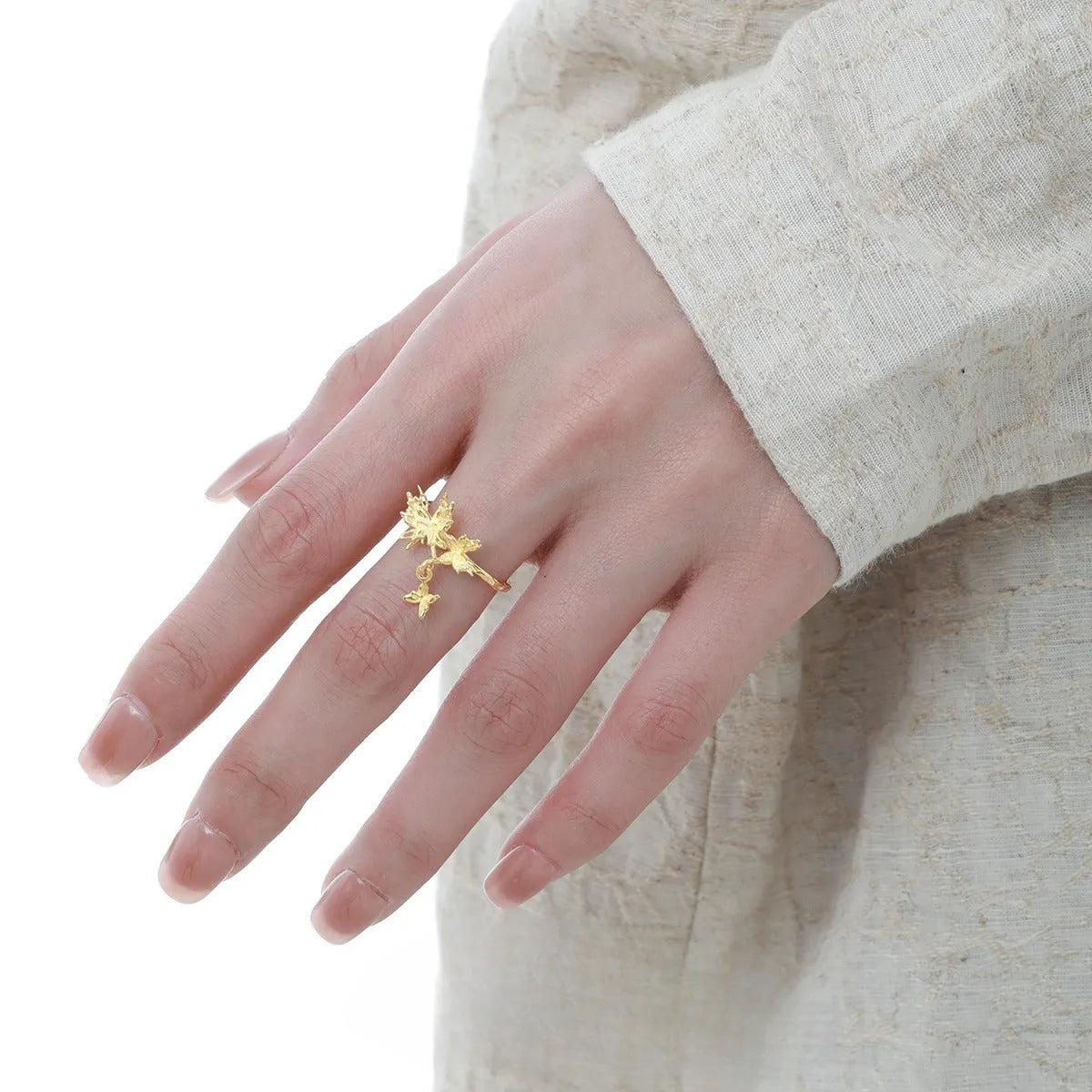 Silver butterfly ring with adjustable opening in white gold or 18K gold colour tone.