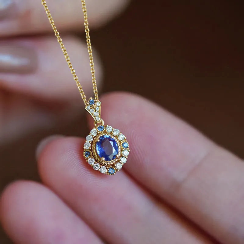 Yellow gold colour royal style necklace with zircon inlaid pendant on an adjustable copper box chain.
