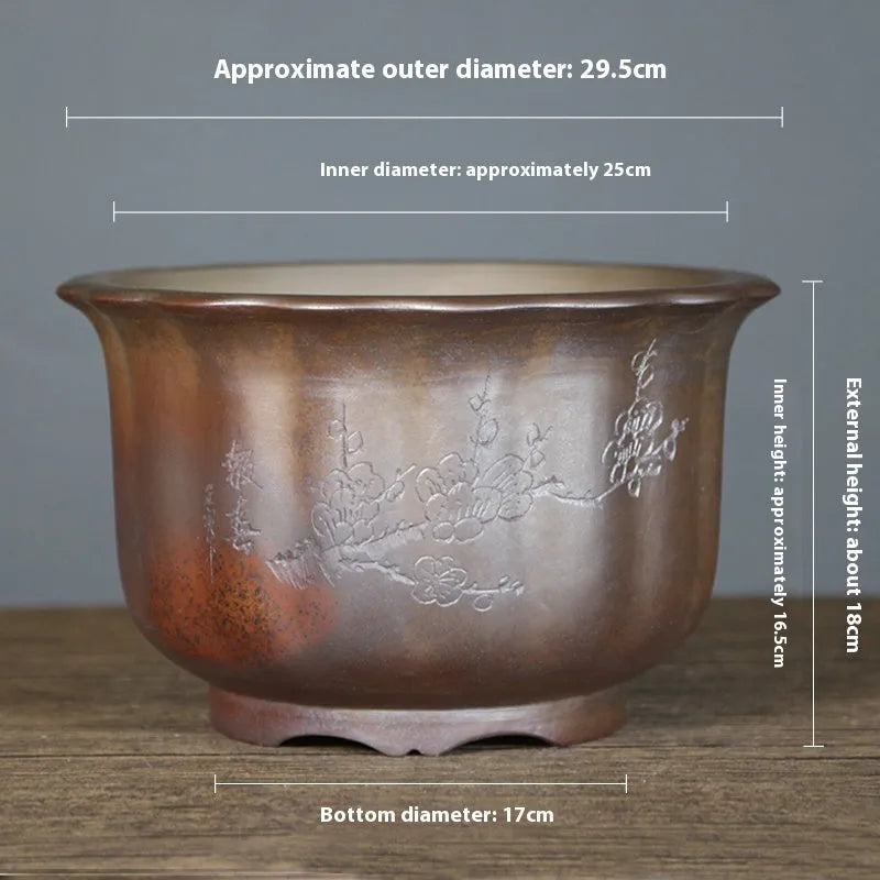 Large indoor ceramic flowerpot with antique carved flower design in purple sand clay