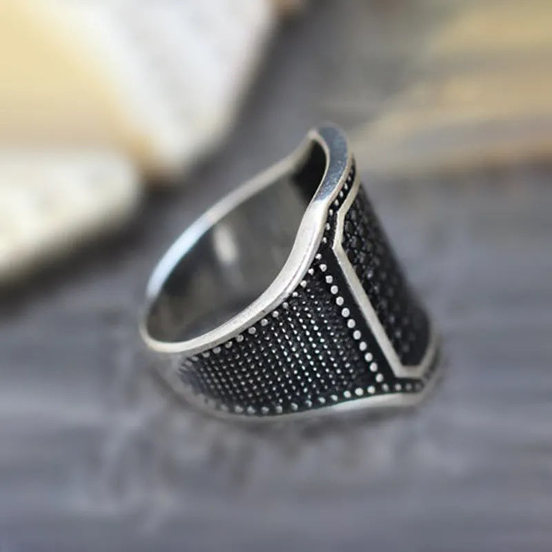 Black alloy ring with copper inlay and zircon stones showing sizes 7 to 13