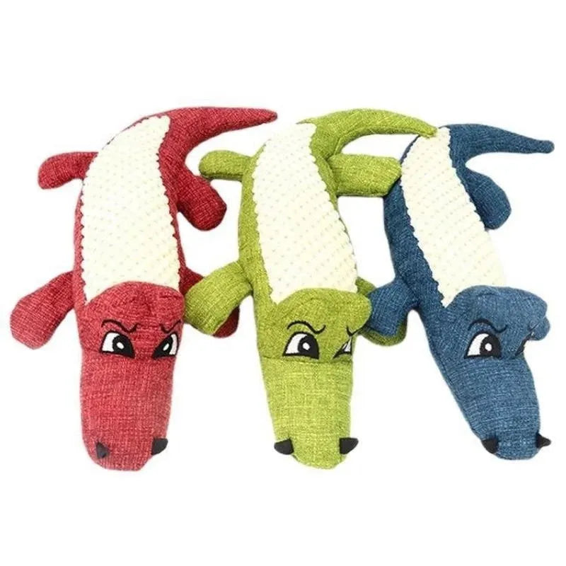 Blue, green, and red plush pet toys with corn grid texture and biting sound feature