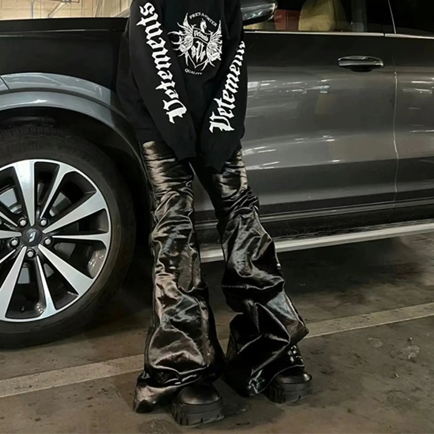 Black shiny patent leather skinny jeans with straight leg cut and mid waist fit