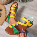 Women's flat sandals with Velcro strap on a round toe, shown in black, brown, and multi-colour options.