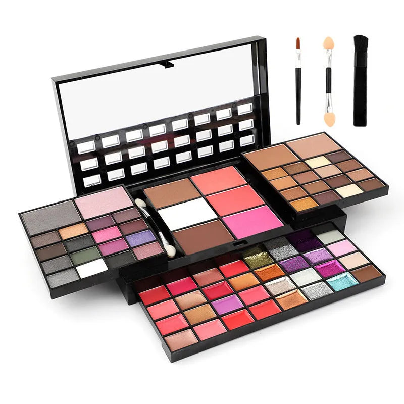 74 colour makeup palette open showing eyeshadows, lip glosses, concealers, blushes, and contour powders with included brushes