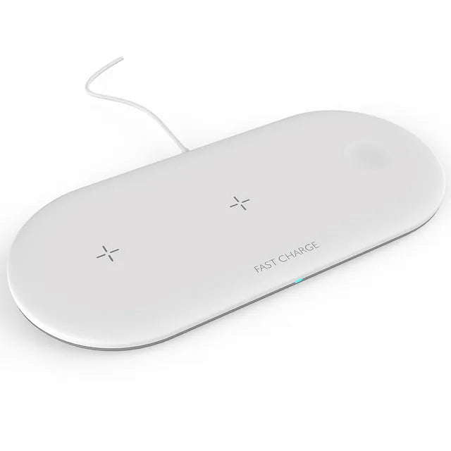 A black or white 3-in-1 wireless charging station for Apple iPhone, watch, and headphones on a desk.