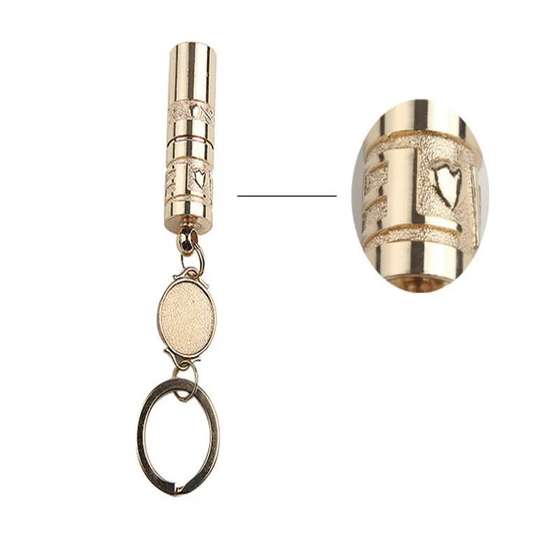 Gold-coloured zinc alloy waterproof mini LED flashlight on a keychain.