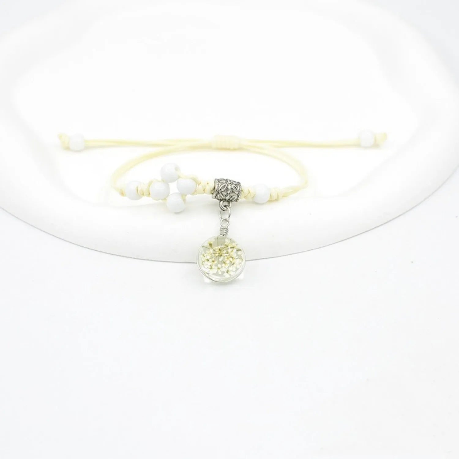 Glass dried flower bracelet with large 1.4 cm beads containing real preserved flowers in hand-woven lace design