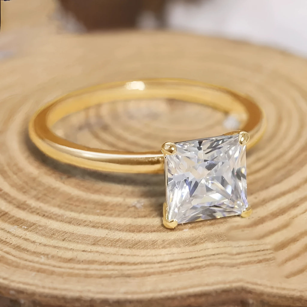 Simple geometric round sterling silver ring shown in silver, gold, and rose gold colour variations on a grey background.