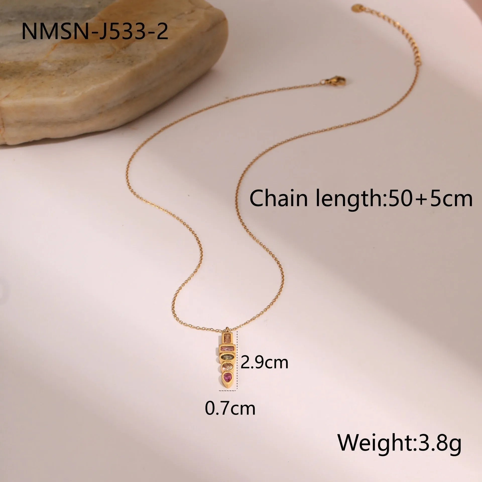 Geometric gold plated jewellery set showing necklace, ring, and earrings with chain-style design