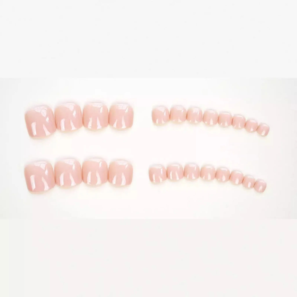 Fashion personality plastic toe nail stickers in skin colour with glue bottle for application.