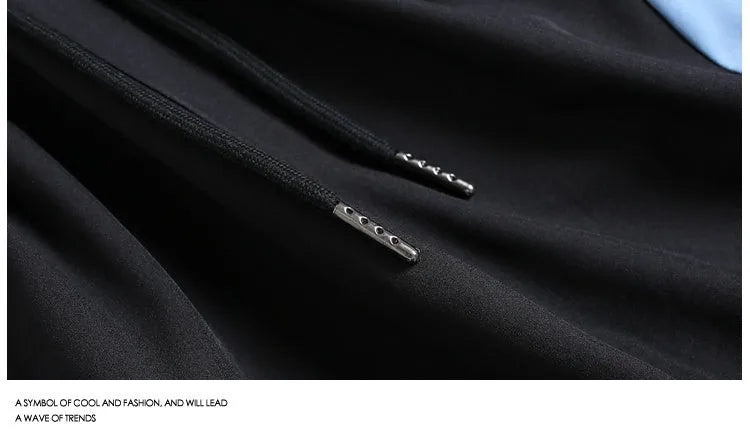 Quick-drying black and grey sports shorts with elastic waistband and straight-leg fit