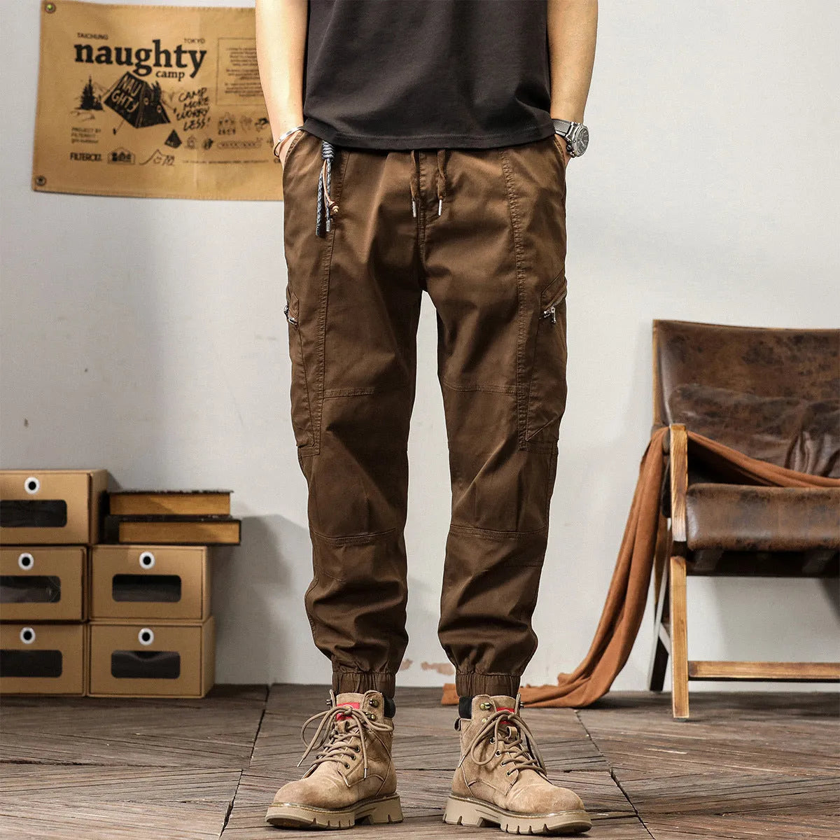 Men's loose khaki cotton harem trousers with tapered leg and ankle banding.