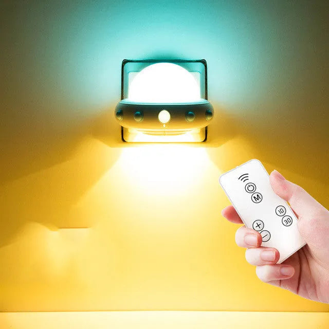 Blue remote control UFO shaped bedside night light with dimensions 105mm by 76mm by 58mm