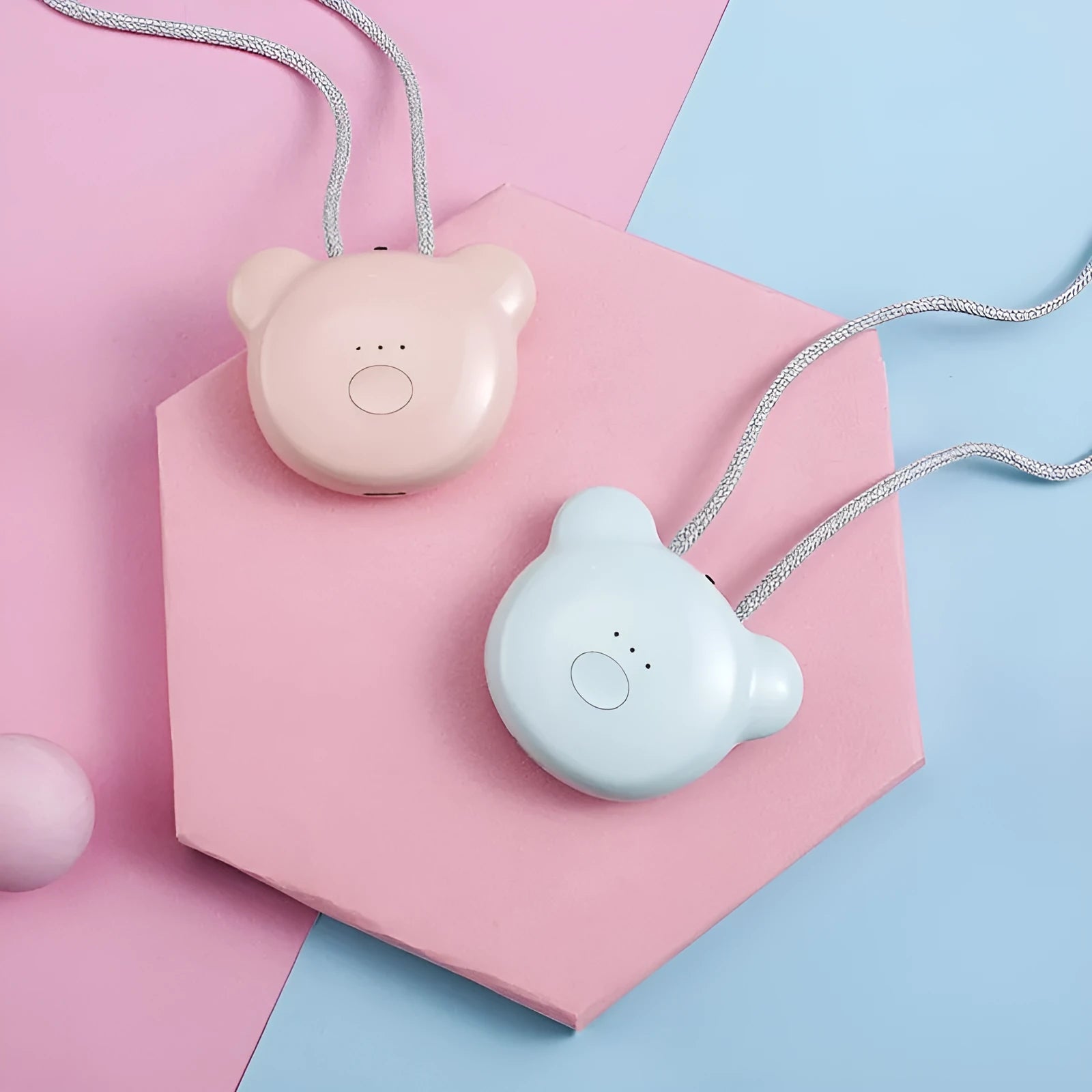 Mini USB portable air purifier necklace in pink, showing compact design with a wearable collar.