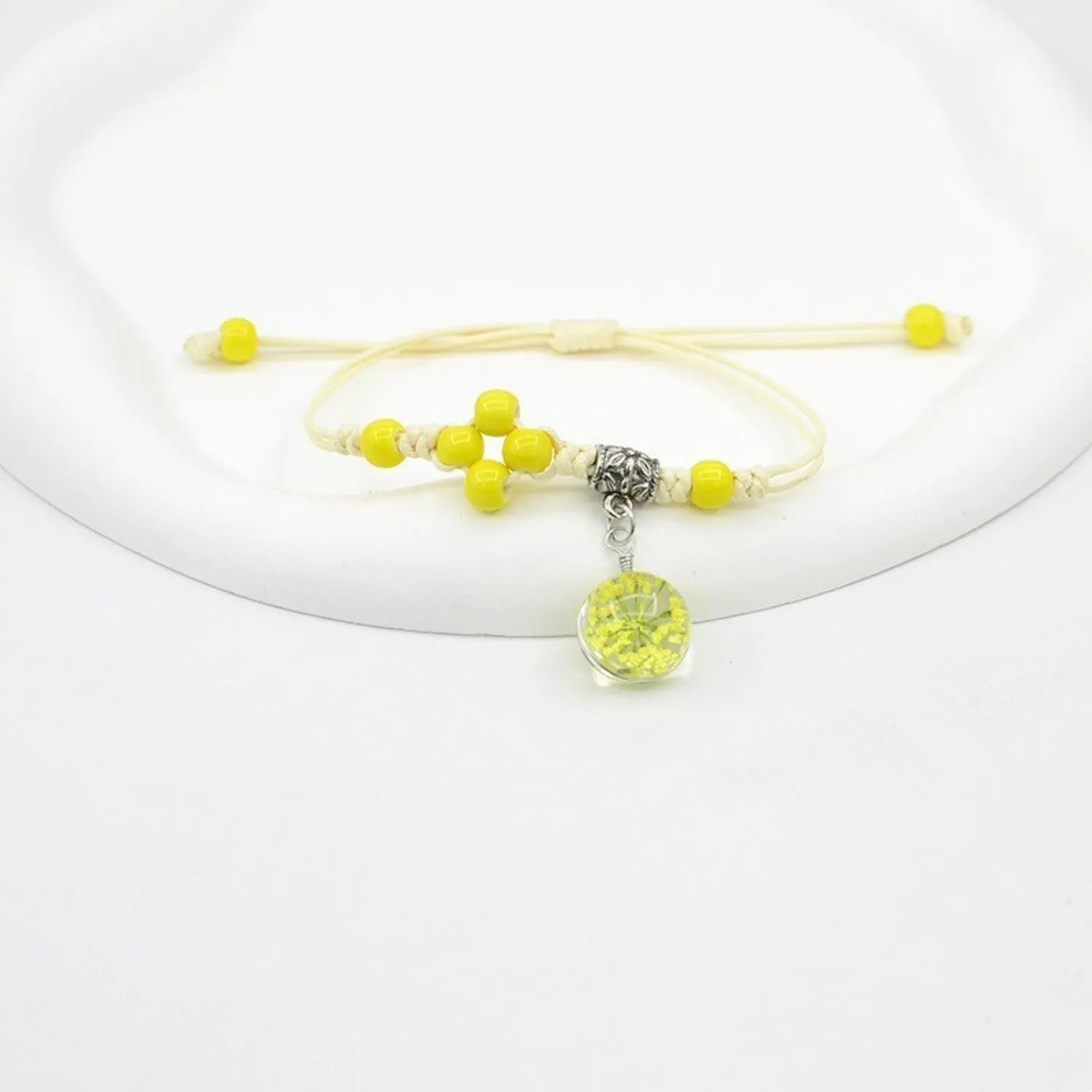 Glass dried flower bracelet with large 1.4 cm beads containing real preserved flowers in hand-woven lace design