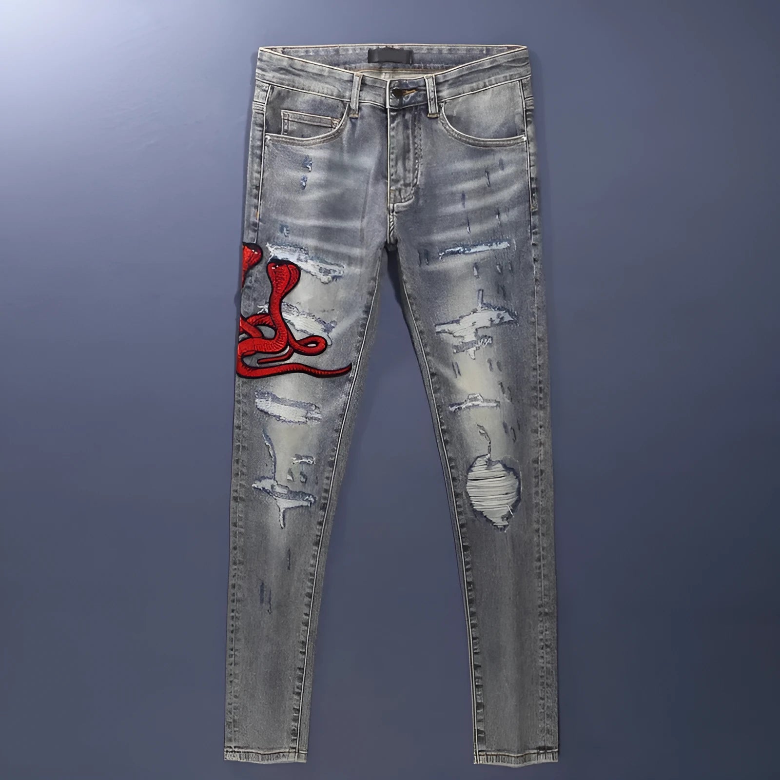 Men's slim fit old colour jeans with hole patch detail and embroidered branding on the leg
