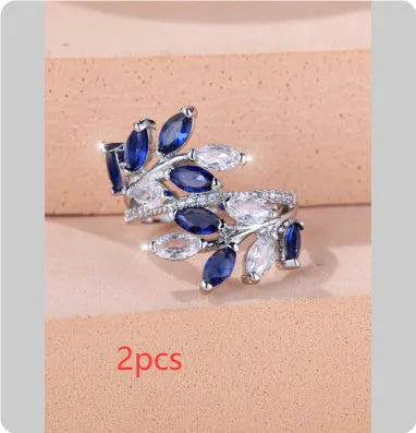 Adjustable horse eye zircon leaf ring in copper on a hand, showing leaf detail and colour options.