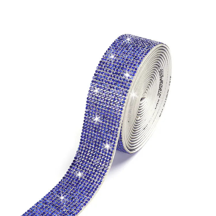 Self-adhesive glass water drill strip on a one-yard reel for shoe and clothing decoration.