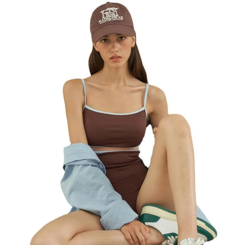 Brown triangle one-piece swimsuit for women on a hanger.