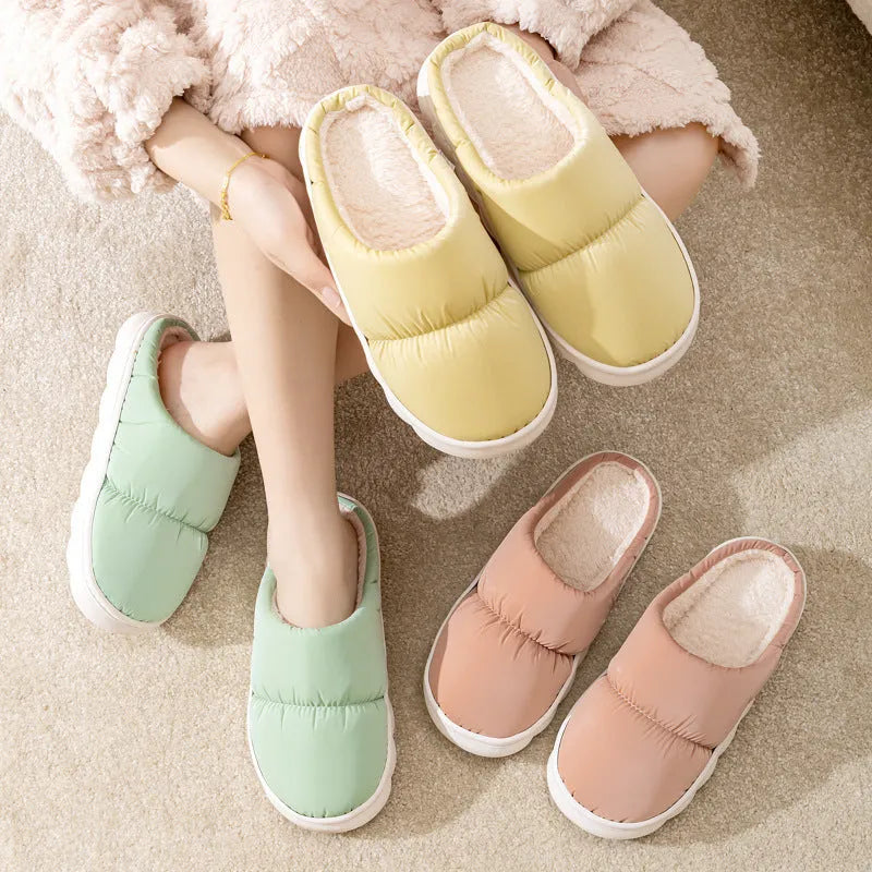 Blue winter slippers with artificial leather upper and thick rubber sole, showing plush lining.