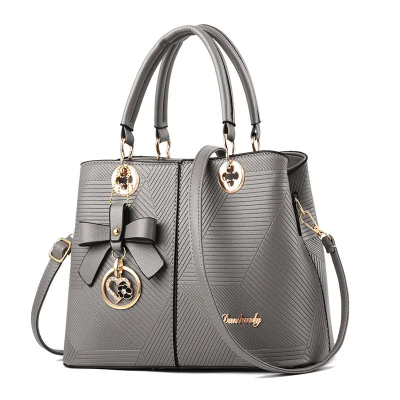 Retro PU leather handbag with zipper closure and shoulder strap in assorted colours