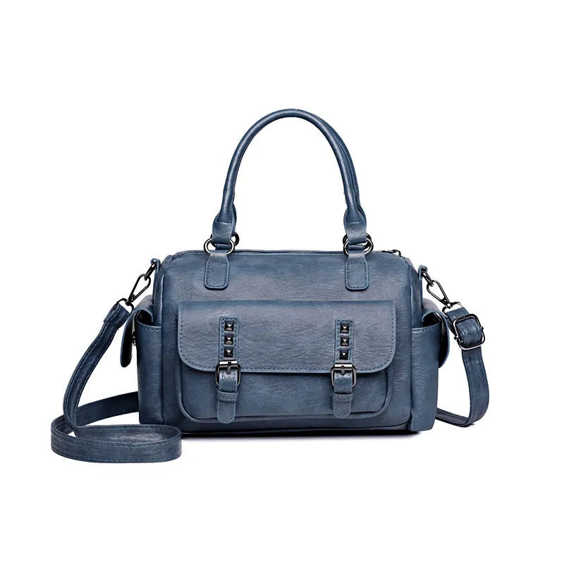 Vintage-style large messenger bag in PU leather, showing horizontal square shape and contrast stitching.