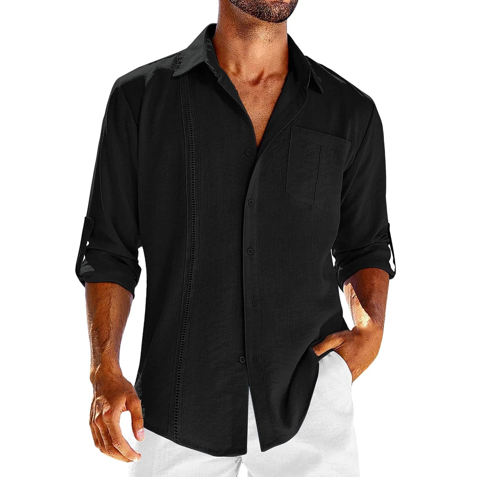A man wearing a solid colour long sleeve shirt with a button-up polo collar and a chest pocket.