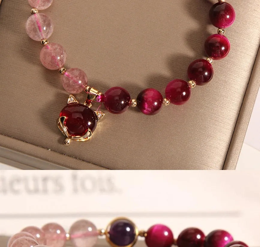 Simple strawberry crystal bracelet for women on a black elastic rope, 18cm long.